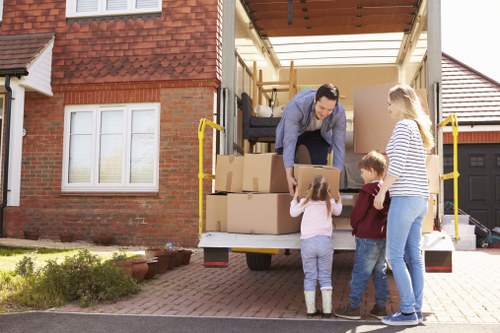 Professional Wandsworth man and van handling furniture collection and delivery in a residential street