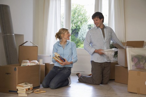 Trained movers using teamwork during a safe relocation