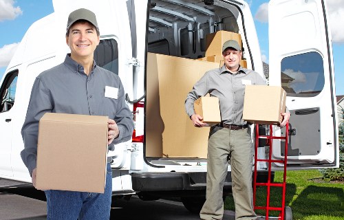 Movers loading furniture for a same day relocation in Wandsworth