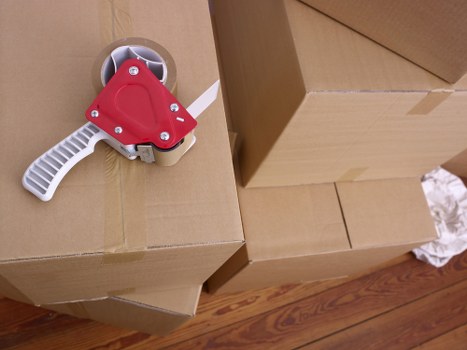 Family preparing furniture for a move using a hire truck