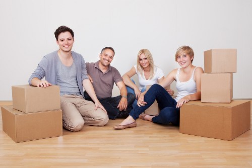 Office movers handling desks and IT equipment