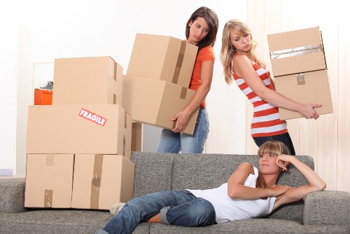 Local office relocation team handling desks and boxes in a Wandsworth workspace